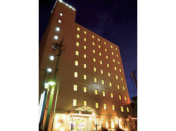 Hotel facade at night.
