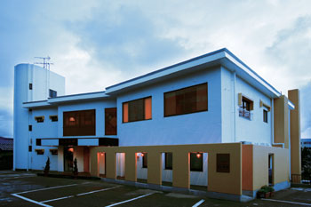 Hotel facade at night.