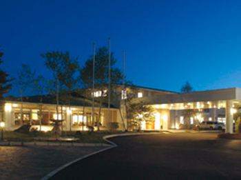 Hotel facade at night.