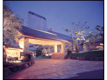 Hotel facade at night.