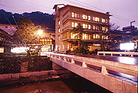 Hotel facade at night.